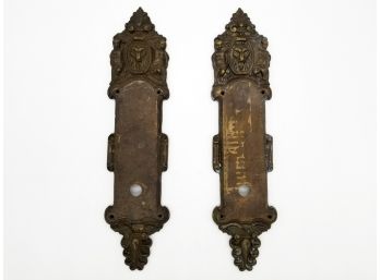 A Pair Of Ornate Lion's Head Motif Backplates