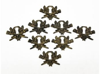 A Set Of 'Torch Of Victory' Bronze Keyhole Covers