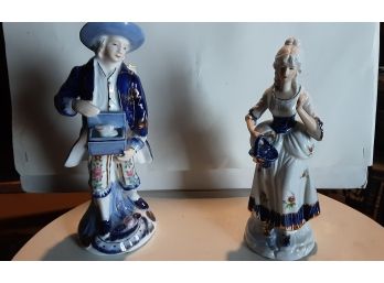A Pair Of Porcelain Figurines