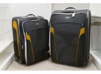 Two Tumi Suitcases