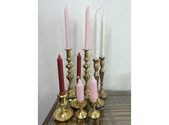 A Collection Of Brass Candlesticks