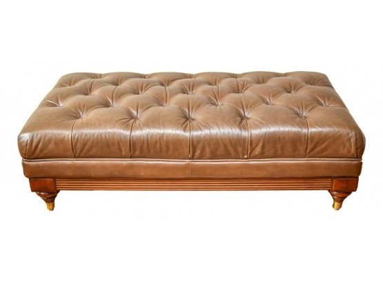 Tufted Leather Ottoman With Wooden Base On Brass Casters