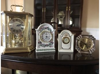 Grouping Of Four Table Clocks Of Varying Sizes
