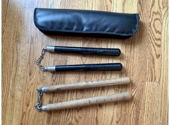 Two Sets Of Wood And Metal Nunchucks With One Carry Case