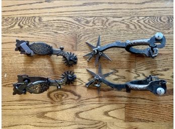 Two Sets Of Finely Detailed Dark Metal Spurs
