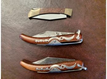 Three Wooden Handled Pocket Knives, Including Okapi Knives From South Africa