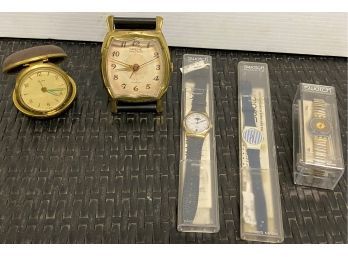 Two Travel Clocks And Three Swatch Watches