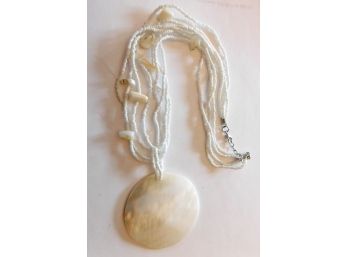 Necklace Of White Beads With A MOP Like Pendant