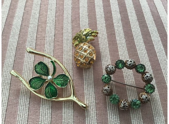 Three Green And Gold Tone Pins Including A Pineapple, Wreath, And Horseshoe - Lot #10