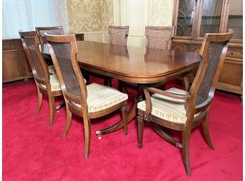 A Vintage Neoclassical Mahogany Dining Table And Caned Chairs