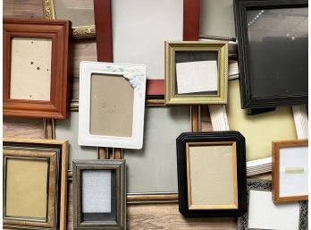 A Large Collection Of Small Photo Frames