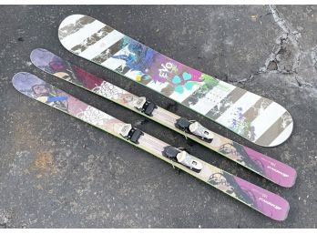 A Snowboard And Skis
