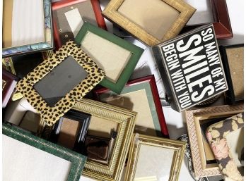 A Large Assortment Of Photo Frames
