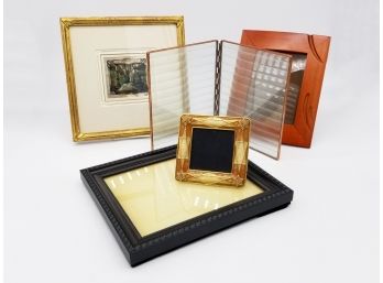 A Collection Of Small Photo Frames