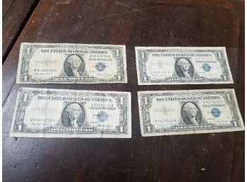 Lot Of 4 Silver Certificate One Dollar Bills (1957, 1957A, 1957B & 1935E). All Are Complete But Worn As Seen I