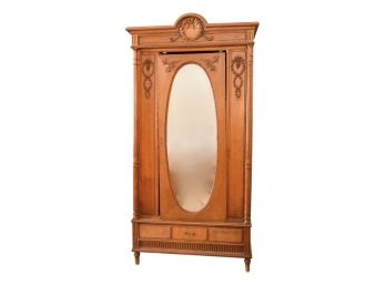 Antique Carved Wood Armoire With Oval  Beveled Glass Mirrored Door