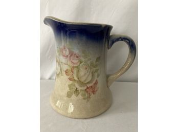 Antique Pitcher Blue That Fades From The Top To Bottom With Gold Accents With Flowers.