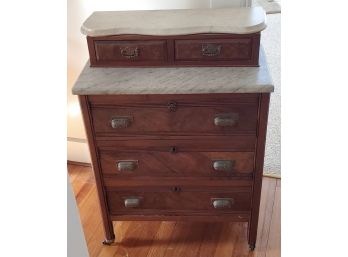 Antique Bedroom Chest With 2 Small Drawers Over 3 Large With Marble Tops, 4 Metal Casters On Legs