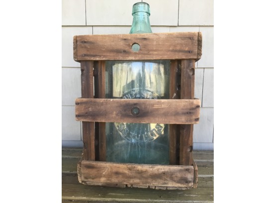 Vintage Water Bottle In Wooden Crate