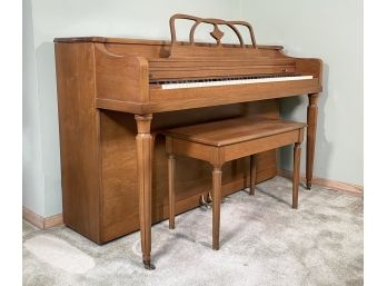 A Vintage Winter Console Upright Piano