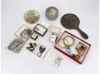 An Assortment Of Vintage Costume Jewelry And Vanity Top Pieces
