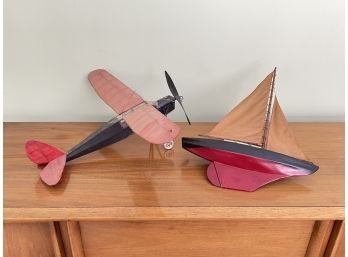 A Vintage Airplane And Ship Model