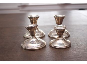 Four Weighted Sterling Candle Stick Holders