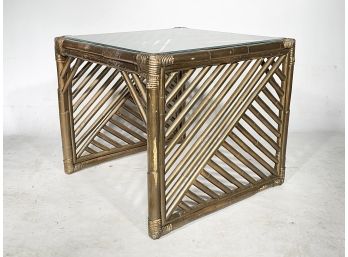 A Vintage Rattan Side Table With Glass Top