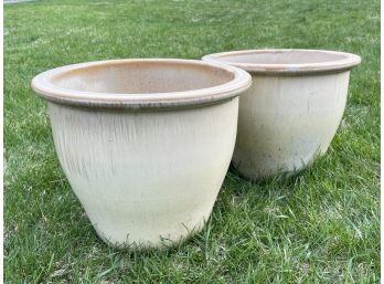 A Pair Of Glazed Earthenware Planters