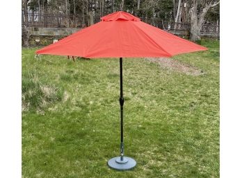 An Aluminum Sunbrella Umbrella On Stand
