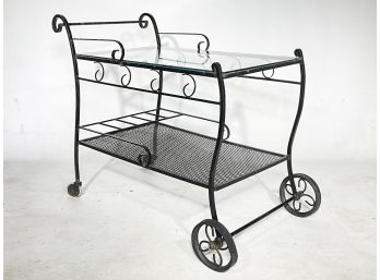 A Vintage Wrought Iron Glass Top Bar Cart