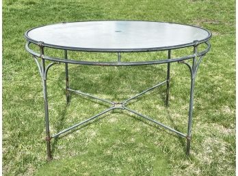 A Vintage Wrought Iron Glass Top Patio Table