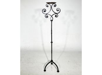 A Vintage Wrought Iron Candle Holder