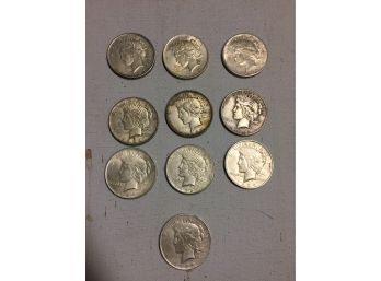 10 American Peace Silver Dollars Mixed Dates Good Condition.