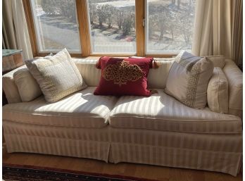 White Upholstered Couch With Pillow Accents
