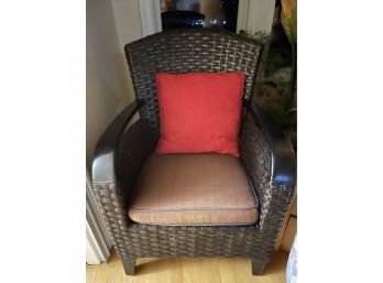 Brown Rattan Side Chair With Red Pillow
