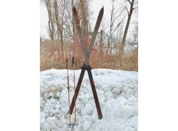 Pair Of 8 Foot Long Wood Skis With Leather Strap And Poles