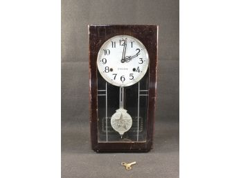 Eikeisha Contemporary Styled Wood & Glass Wall Clock With Pendulum & Key