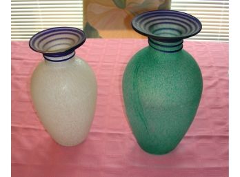 Two Glass Vases With Swirl Design At Neck