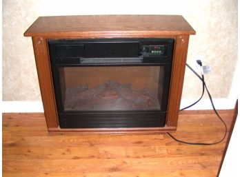 Heat Surge Portable Heater With Fireplace Logs Display