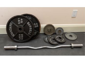 Collection Of Standard Barbells And Lifting Bar
