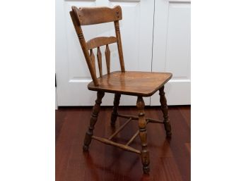 Vintage Wooden Chair With Carved Accents And Turned Legs