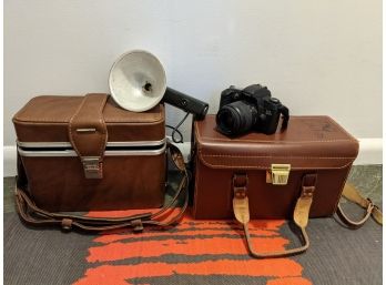 2 Heavy Leather Antique Camera Cases Filled With Old Accessories And Cannon Camera