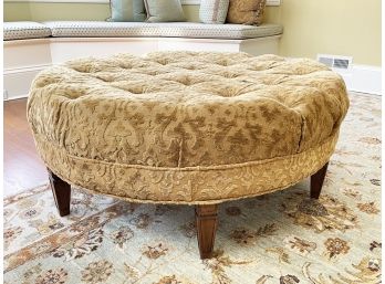 A Large Upholstered Ottoman In Tufted Brocade