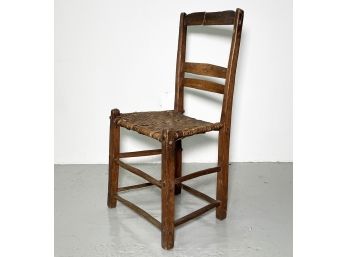 An Antique Rush Seated Ladderback Chair (AS IS)