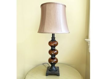 A Bronze And Glass Decorative Lamp