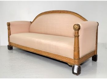 An Antique Upholstered Sofa With Gilt Lion Head Motif Frame