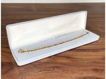 A Tennis Bracelet In Gold Plated Sterling Setting