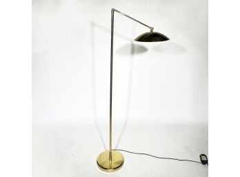A Modern Standing Lamp In Polished Brass