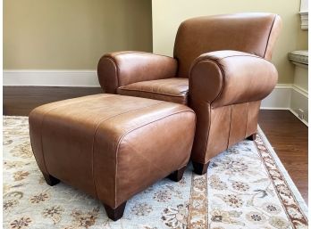 A Chestnut Leather Arm Chair And Ottoman By Mitchell Gold For Pottery Barn